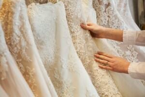Rows of wedding dresses on display in the boutique bridal studio