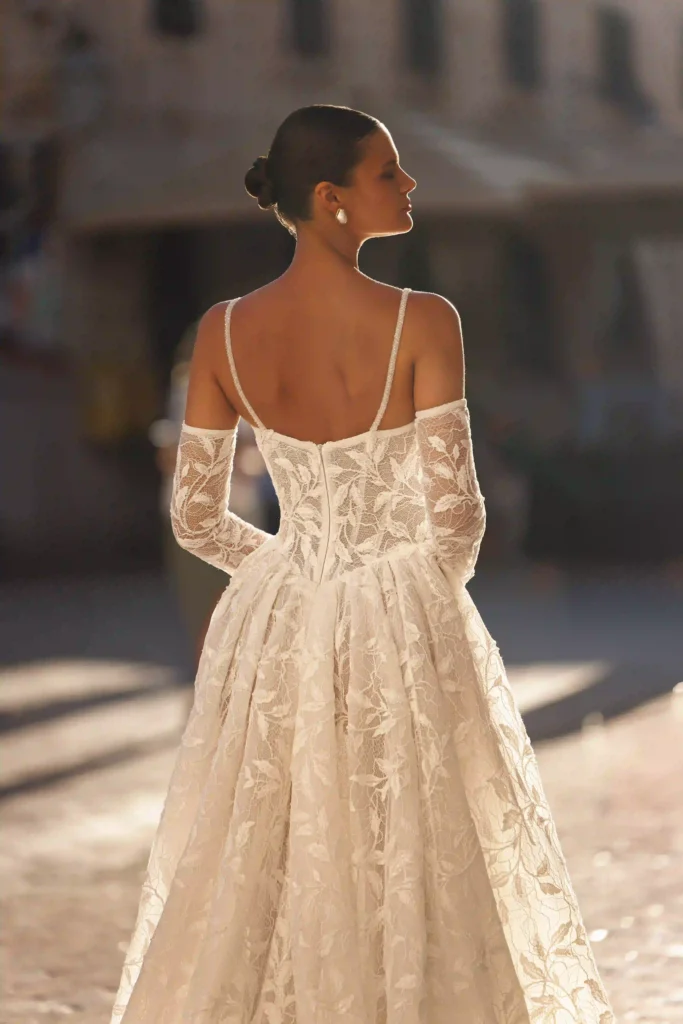 Close back view of Esme from the Lana Grace bridal collection during a bridal fitting consultation
