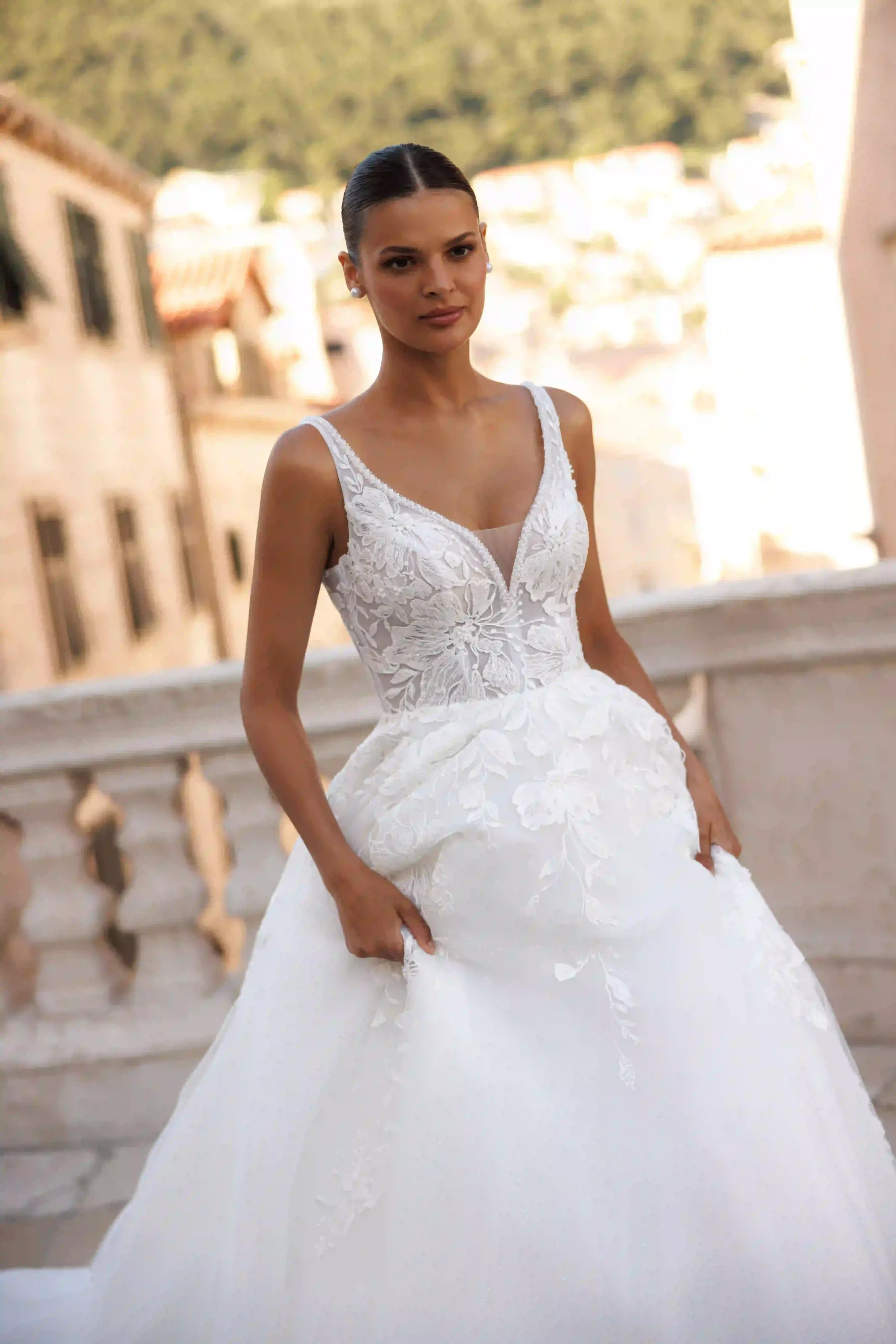 Close front view of Aria from the Lana Grace bridal collection during a wedding dress fitting experience