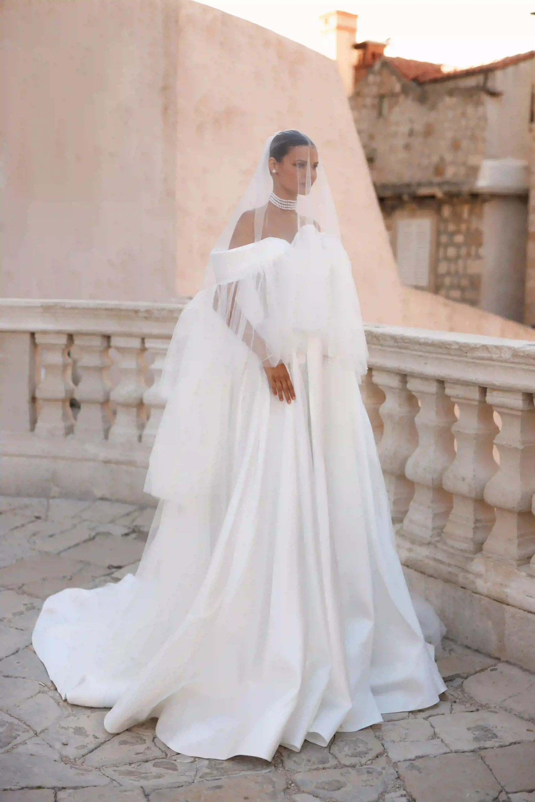 Eliza from the Lana Grace bridal collection shown with veil during a wedding dress fitting experience