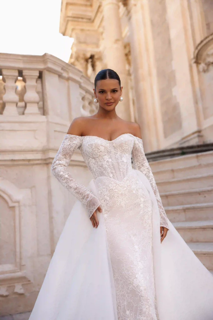 Close front view of Harper with overskirt from the Lana Grace bridal collection during a bridal fitting consultation