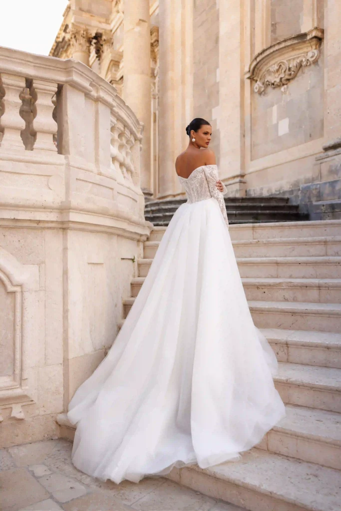 Back view of Harper with overskirt from the Lana Grace wedding dresses collection at a bridal boutique Randburg